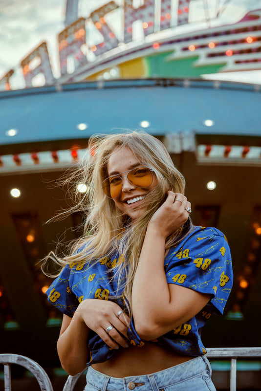 Woman with glasses smiles